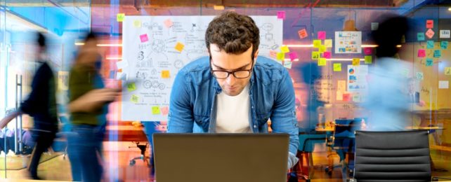 Man On Computer In Creative Office