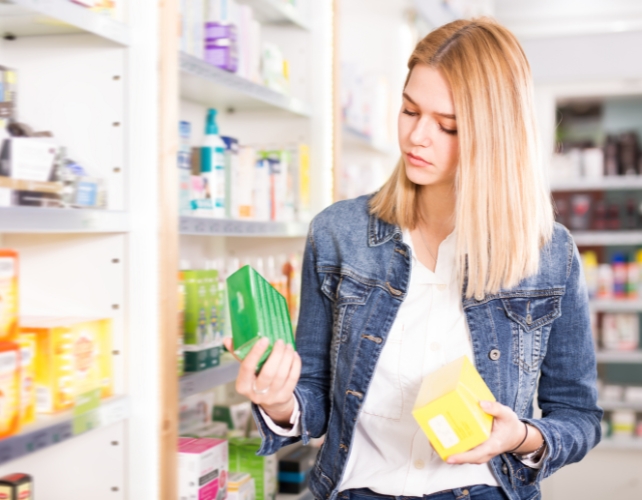 Person looking at products in a pharmacy