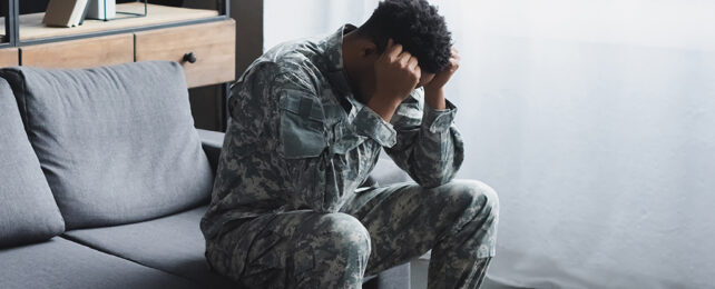 soldier with his head in his hands