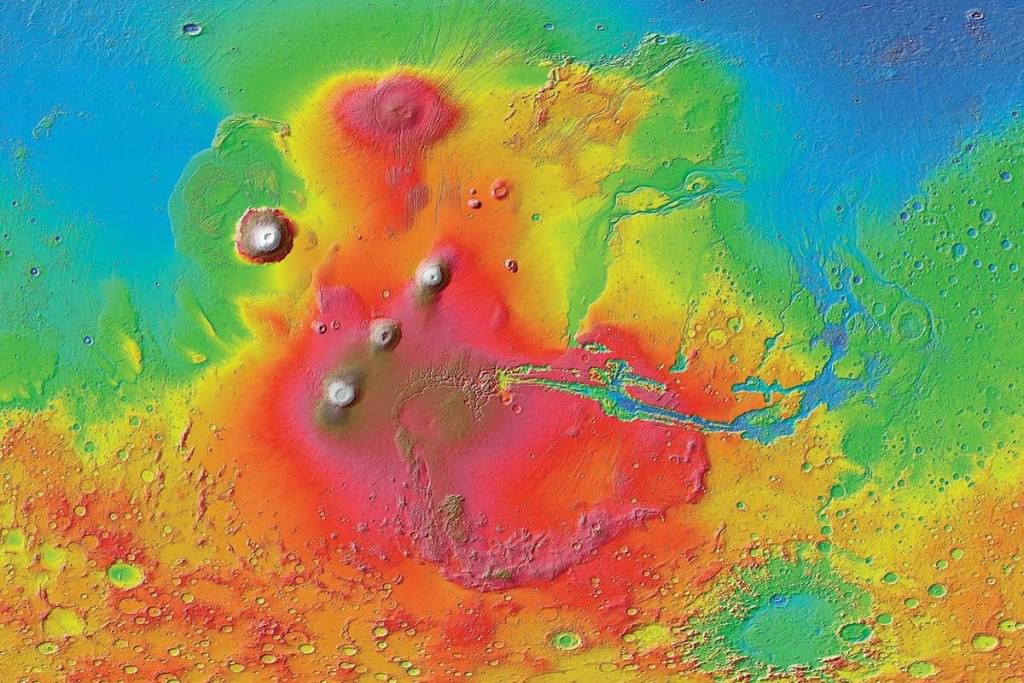 This colourized image of the surface of Mars was created with data from the Mars Reconnaissance Orbiter. The line of three volcanoes is the Tharsis Montes, with Olympus Mons to the northwest and Valles Marineris to the east. Arsia Mons is the southernmost volcano of the three that comprise Tharsis Montes. Image: NASA/JPL-Caltech/ Arizona State University